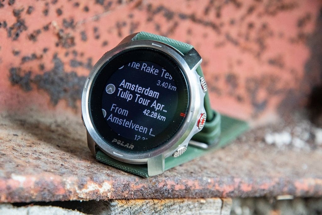 polar grit watch with green strip placed on a surface