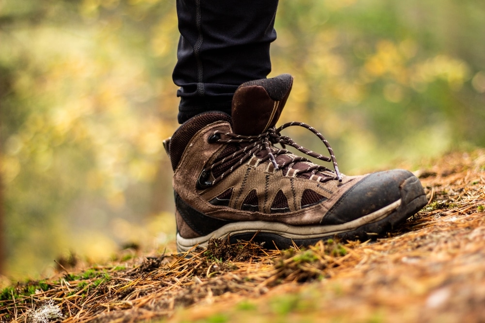 A view of a hiking shoe mid stride