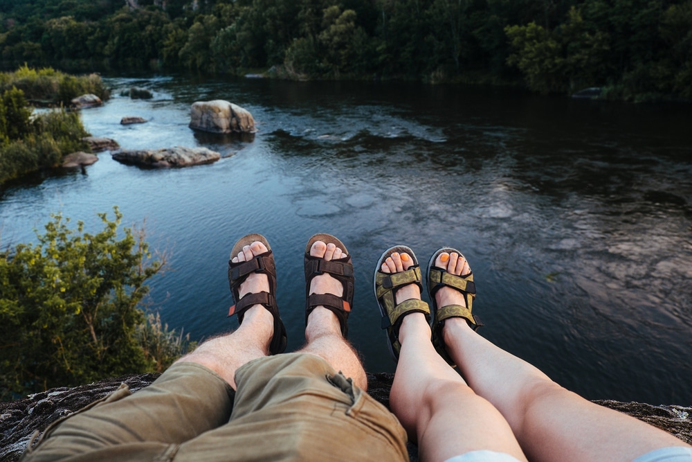 A view of two people wearing hiking sandals