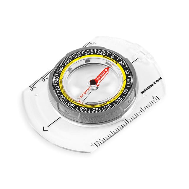 brunton compass infront of white background