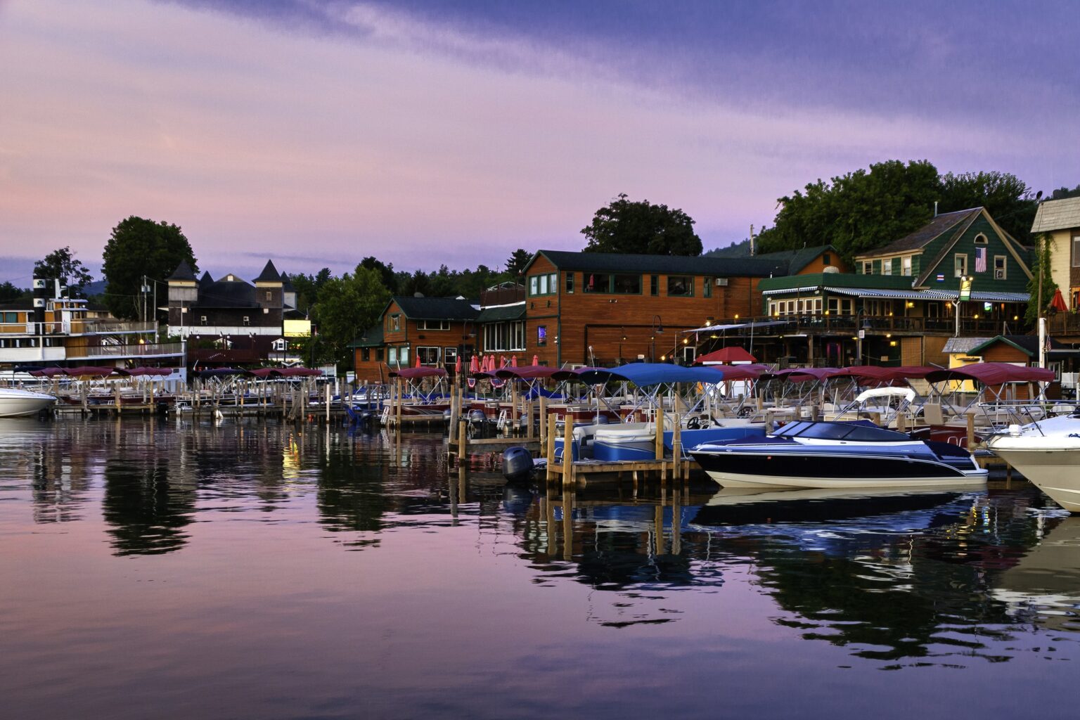 lake george surrounded with boats and hotels