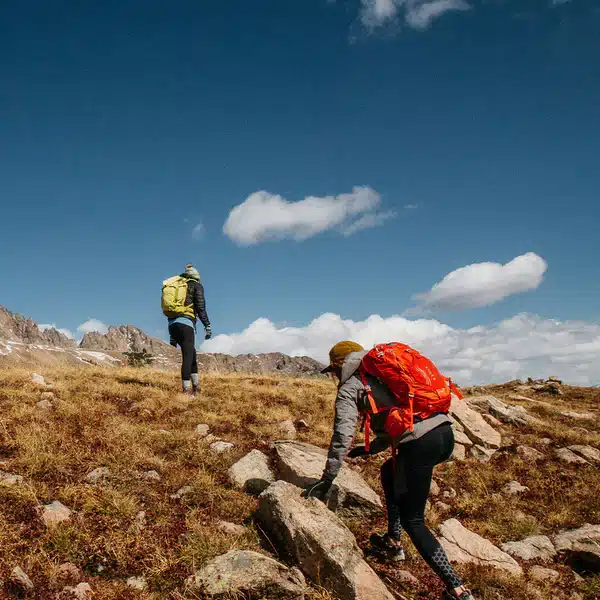 hikers navigating though rocky trek