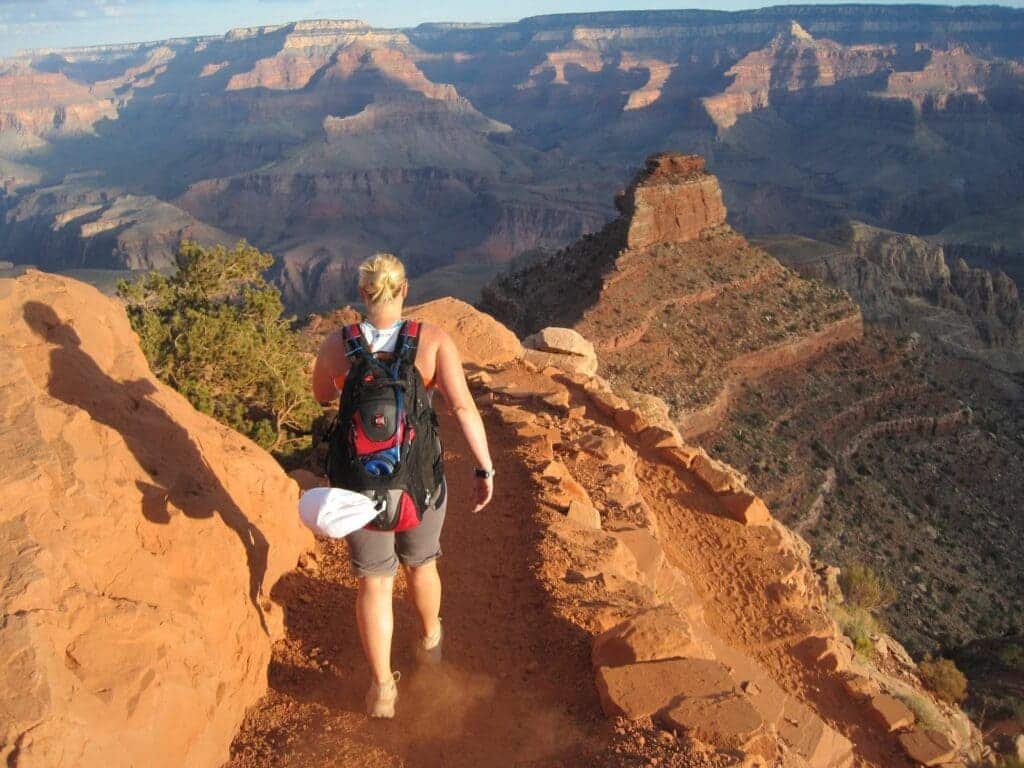 a hiker traversing through Grand Canyon