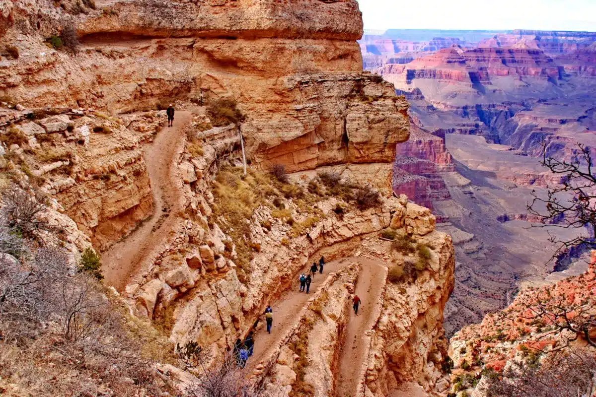 number of people traversing through switchback route in mountains