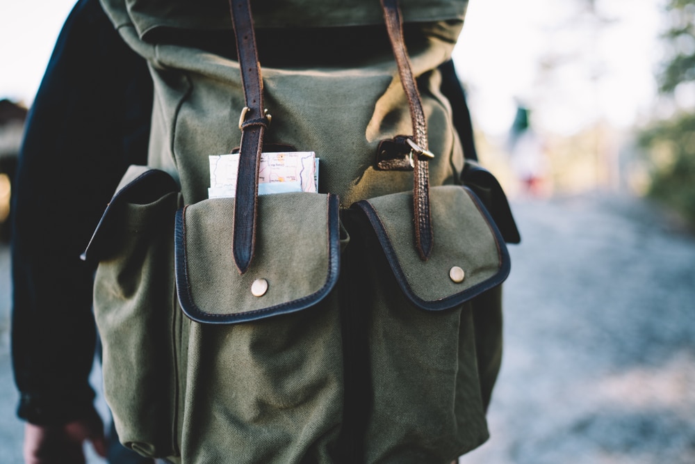 Cropped image of trendy convenient backpack with pockets for carrying equipment in hiking tour