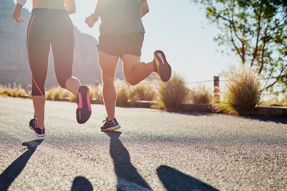 Running, workout and friends or people in nature for exercise, warm up