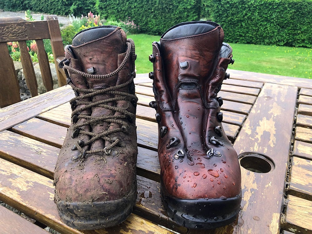 clean and muddy boot placed on a wooden surface