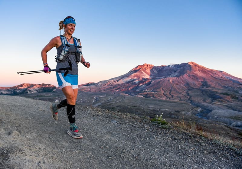 female hiker running on a track