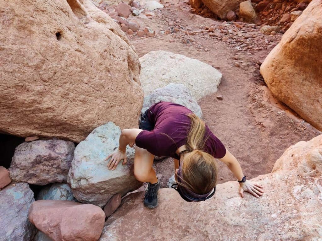 femalw hiker scrambling