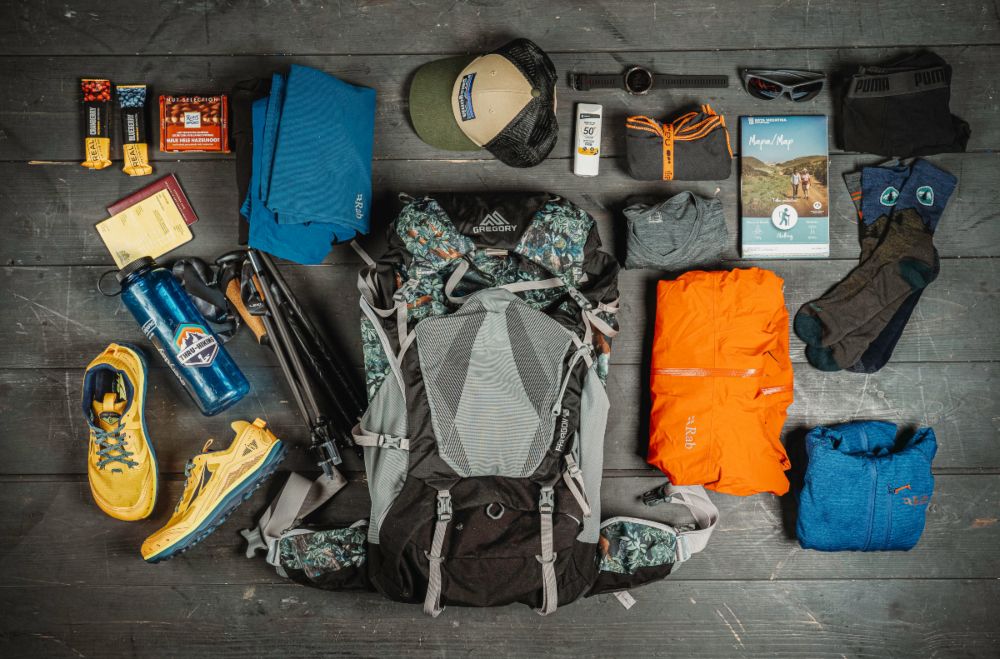 gear for thru hiking on a wooden surface