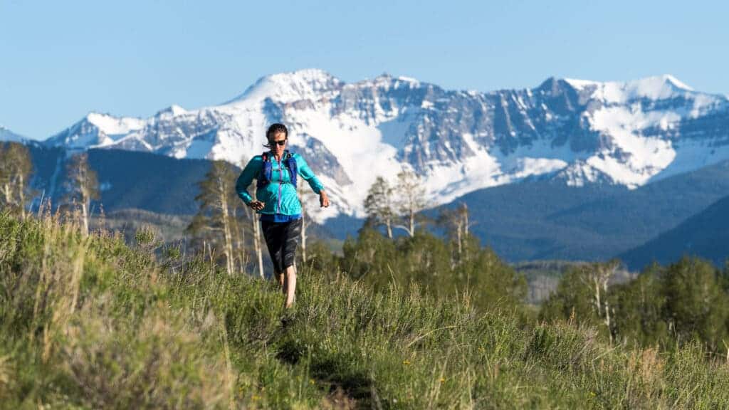 male hiker in a field