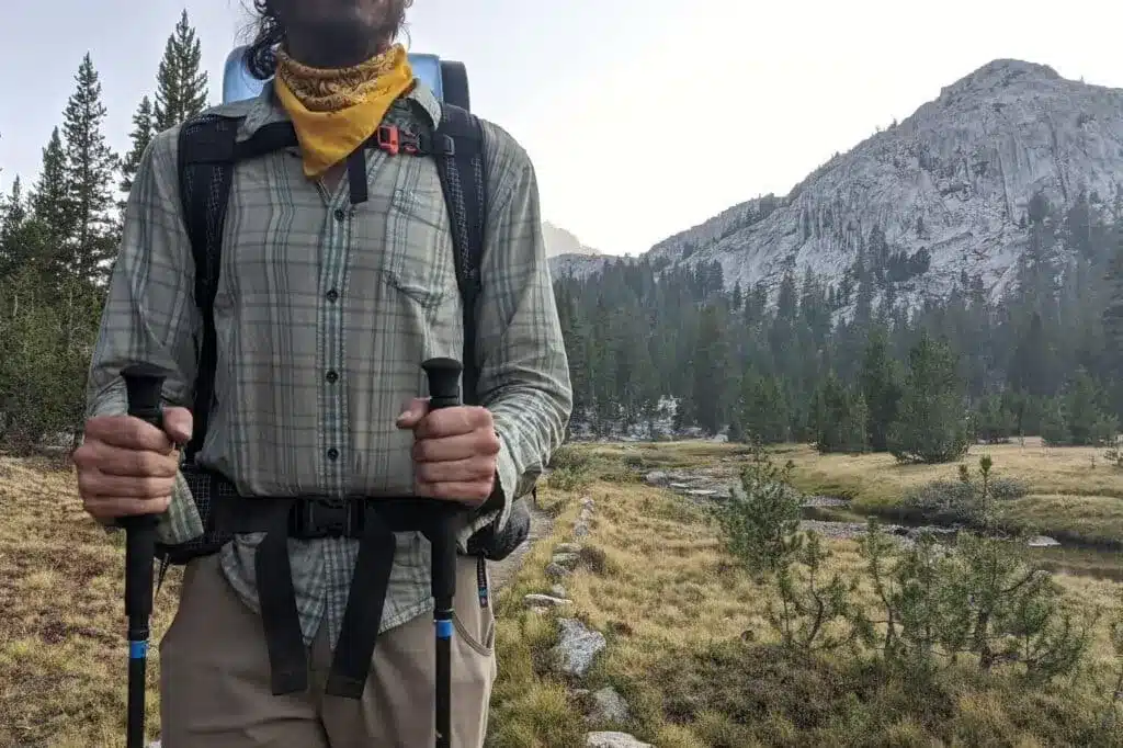 zoomed in view of a person holding two poles