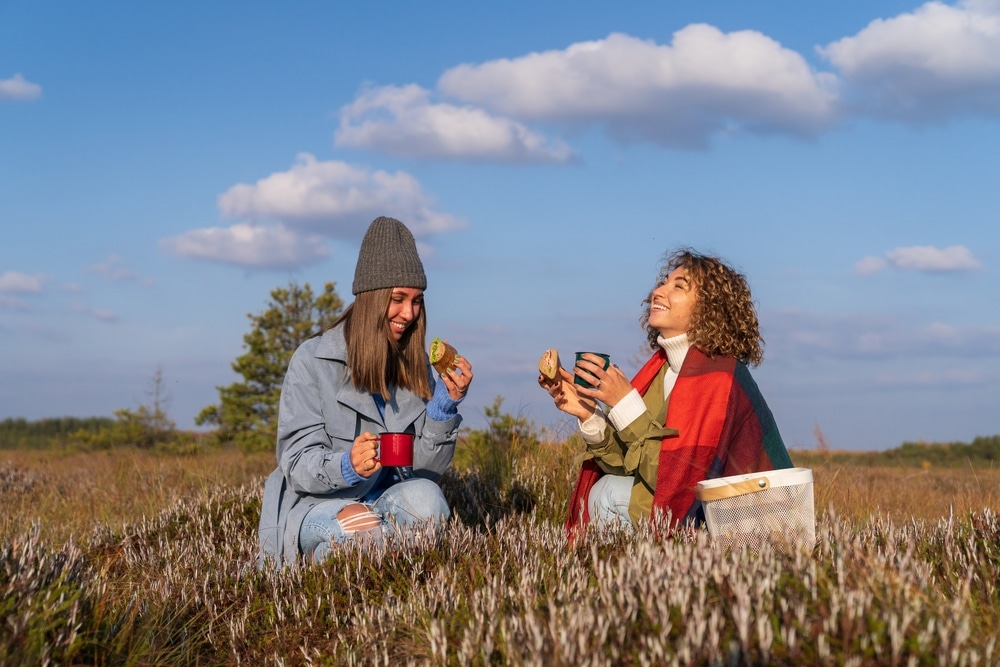 Two Female Friends Enjoy Spending Weekend Together In Nature And