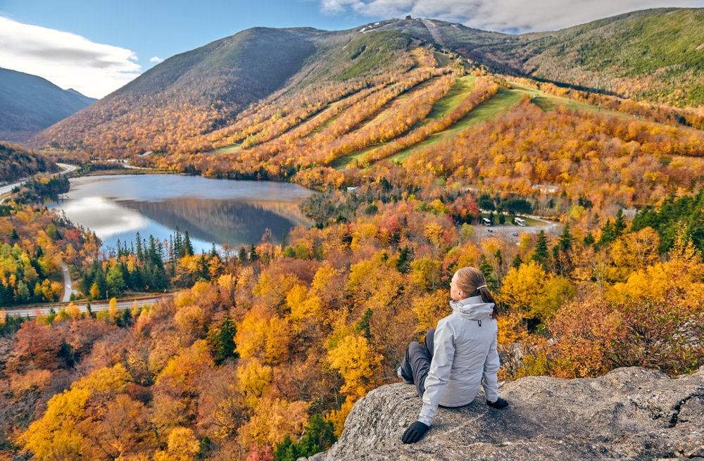 Woman Hiking At Artist's Bluff In Autumn View Of Echo