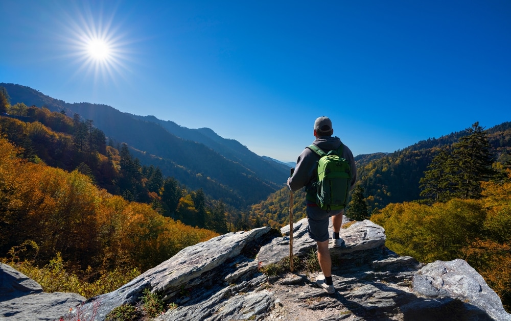 a hiker standing on smoky mountain 