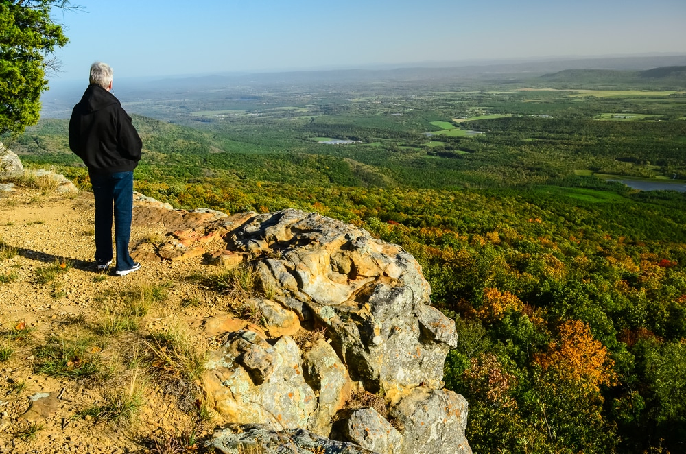 Senior Woman Looking Across The Ozarks Of Arkansas Landscape From